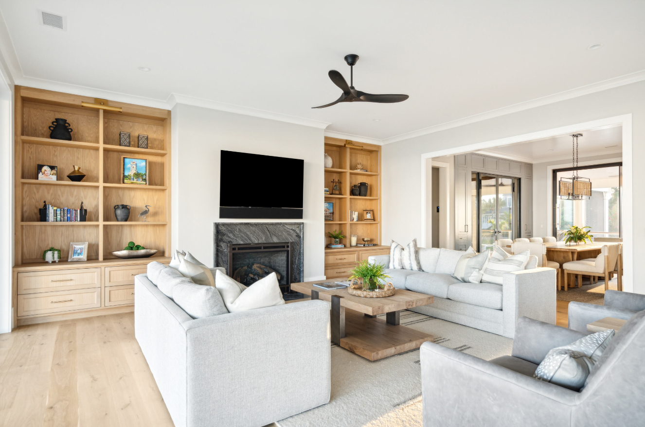 Saunders Wood Works — built-in cabinetry and custom shelving in a coastal great room